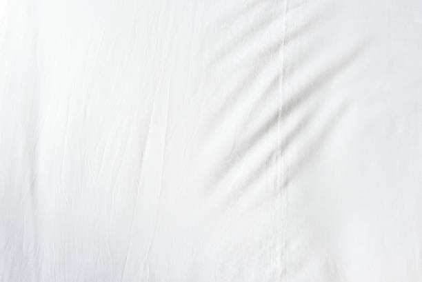 Top view of wrinkles on an unmade bed sheet stock photo