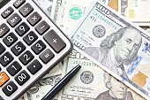 istock Top view or flat lay of calculator and pen on American Dollars cash money 1058269468