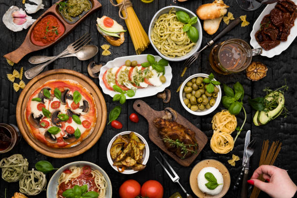 Top view table full of food Top view table full of food Sharing dinner with friends italian culture stock pictures, royalty-free photos & images