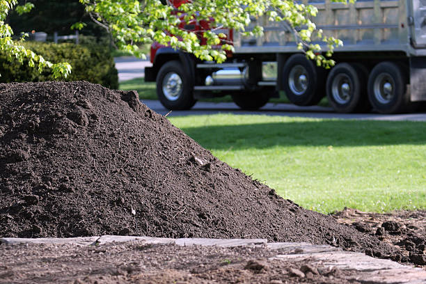 Topsoil Delivery Dump Truck for Residential Landscaping stock photo