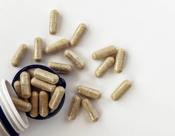 topview of super enzymes capsules in the jar, with negative space. dietary supplement copyspace. mental wellbeing and personal health concept stock photo