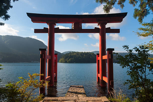Torii Gate with a view of the sea beyond it The torii gate which stands on the shore of Lake Ashi, near Mount Fuji in Japan. shrine stock pictures, royalty-free photos & images
