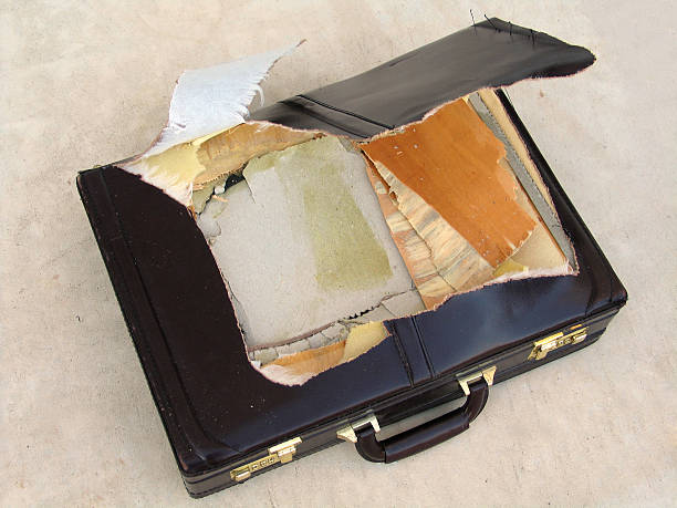 Torn Briefcase  broken suitcase stock pictures, royalty-free photos & images