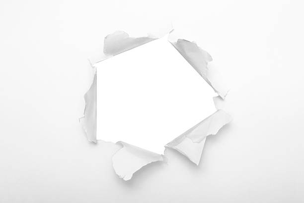 Torn paper hole Torn paper hole over white background. appearance stock pictures, royalty-free photos & images