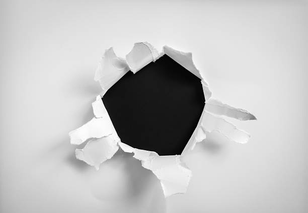 Torn paper hole stock photo