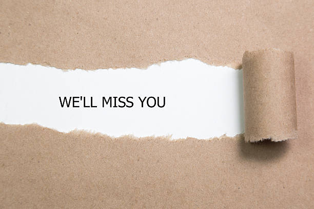 Torn Paper With Text " We'll Miss You " stock photo