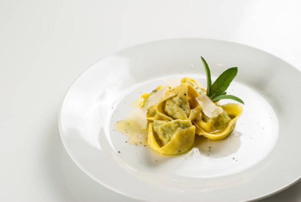 Tortelloni with butter and sage stock photo