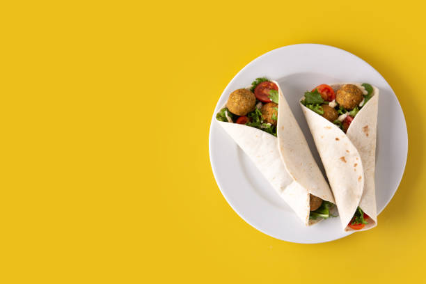 Tortilla wrap with falafel and vegetables stock photo