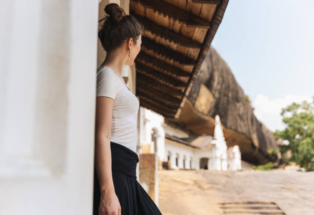 A tourist are visiting Dambulla Cave Temples Woman is looking out from Dambulla Cave Temples dambulla stock pictures, royalty-free photos & images