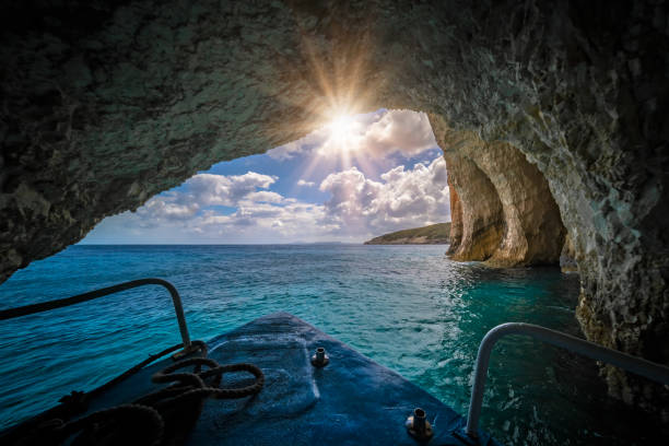 Tourist boat sailing inside the Blue Caves stock photo