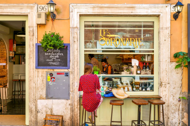 A tourist enjoy life in a trendy Italian restaurant in the historic and baroque heart of Rome stock photo