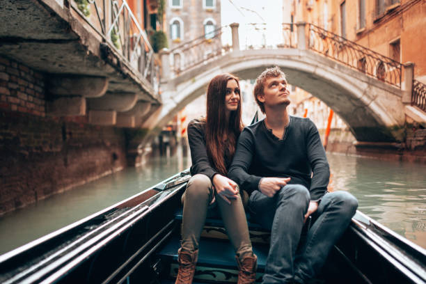 tourist together in the gondola in venezia stock photo