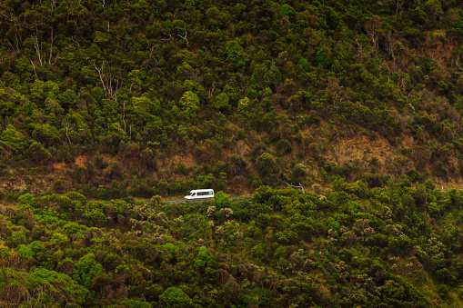 Tourist van driving along Great Ocean Road Victoria.