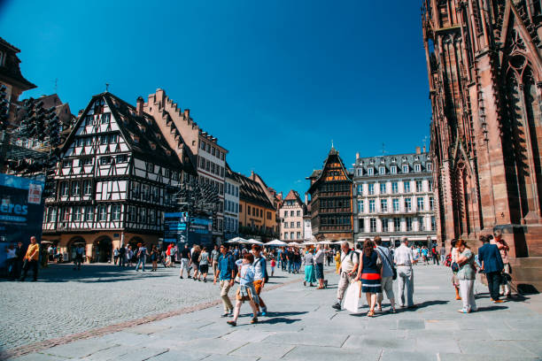 Tourists are sightseeing Strasbourg Petite France Strasbourg, France - 08 21 2013: Tourists are sightseeing Strasbourg Petite France. Strasbourg is the capital and largest city of the Grand Est region of France and is the official seat of the European Parliament. petite france strasbourg stock pictures, royalty-free photos & images