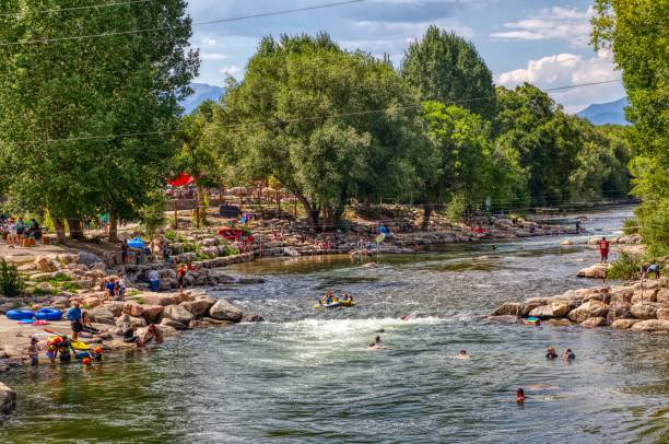 Tourists enjoying the Arkansas River in the Tourist Town of Salida, Colorado Tourists enjoying the Arkansas River in the Tourist Town of Salida, Colorado salida colorado stock pictures, royalty-free photos & images