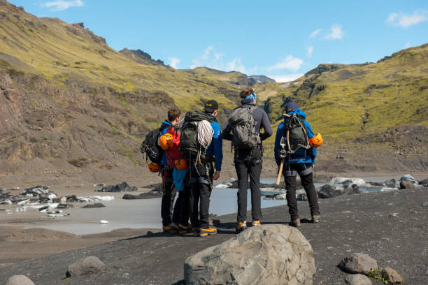 Tourists hiking at Solheimajokull glacier, Iceland stock photo
