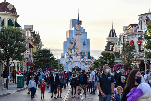 Paris, France - August 20th 2021:  A large number of masked tourists managing to enjoy Disneyland Paris despite Covid-19 restrictions