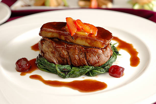 Tournedos Rossini Tournedos Rossini. steak with foie gras. french steak dish with foie gras and croutons. liver offal photos stock pictures, royalty-free photos & images