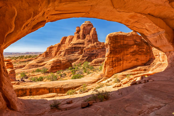 Tower Arch Looking through Tower Arch in the Klondike Blufs area of Arches National Park, Utah. arches national park stock pictures, royalty-free photos & images