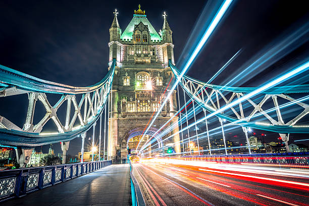 Tower Bridge Light Trail Colourful light trail created by the busy traffic on Tower Bridge, London. tower bridge stock pictures, royalty-free photos & images