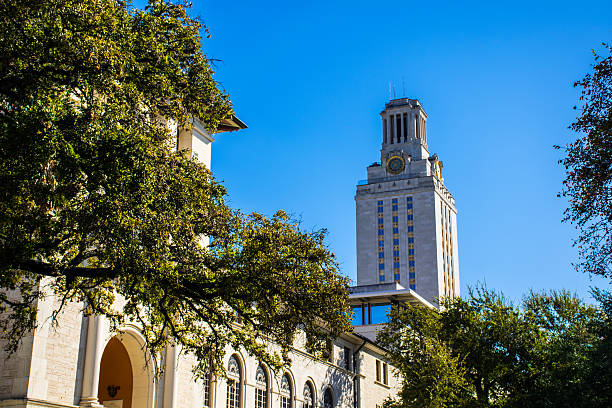 UT Tower Campus Courtyard Nice Morning Sunshine UT Tower Campus Courtyard Nice Morning Sunshine on the University of Texas at Austin with the UT Clock Tower in the background standing tall on a nice clear Sunny Blue Sky morning. Also the same tower that the UT Tower Mass Shooting took place. universities in texas stock pictures, royalty-free photos & images