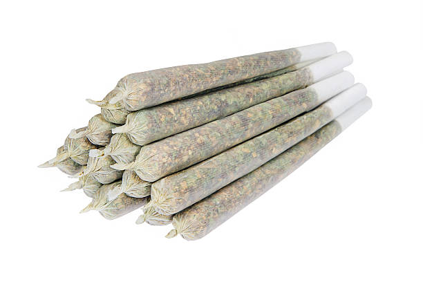 Tower of marijuana joints Tower of marijuana joints isolated on white background marijuana joint stock pictures, royalty-free photos & images