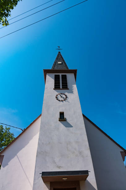tower of white church in Ingolsheim, France church in Ingolsheim, France bas rhin stock pictures, royalty-free photos & images
