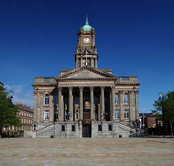 Town Hall building in England, Birkenhead Birkenhead Town Hall is a town hall and former civic building in Birkenhead, on the Wirral Peninsula, England. The building was the former administrative headquarters of the County Borough of Birkenhead, and more recently, council offices for the Metropolitan Borough of Wirral. Birkenhead Town Hall remains the location of the town's register office. Building was designed by local architect Charles Ellison in 1882. the wirral stock pictures, royalty-free photos & images