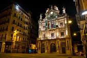 Night view of the City Hall of Pamplona. From the balcony of this building every year starts the Sanfermines, the biggest festival in the city and one of the most famous celebrations in the world.