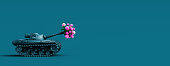 istock Toy tank fires a bouquet of flowers. Peace concept background 1301047720