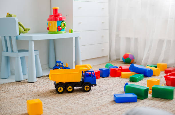 toys on the floor in the nursery stock photo