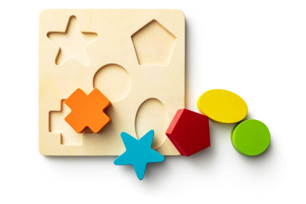 speelgoed: vorm puzzel geïsoleerd op witte achtergrond - blok vorm stockfoto's en -beelden