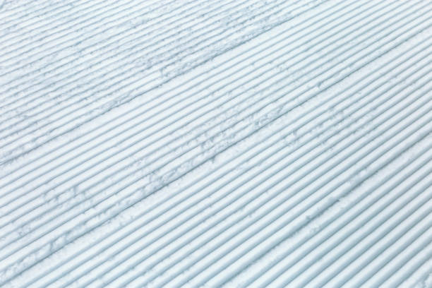 trace of snowâ groomer on snow. snow velvet. ski and snowboard track. prepared snow track. - kemerovo imagens e fotografias de stock