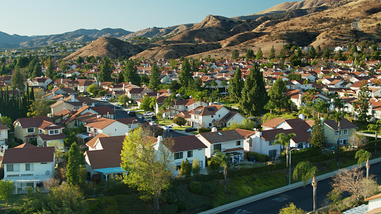 Aerial drone still showcasing suburban track housing in the San Fernando Valley's Porter Ranch neighborhood in Los Angeles.