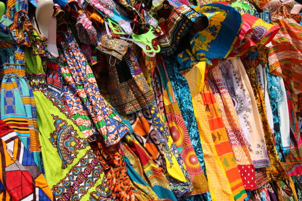 Traditional African Textiles Stall, Lomé, Togo, West Africa Beautiful decorated stalls offer colorful African Textiles in Lomé, Togo, West Africa. togo stock pictures, royalty-free photos & images
