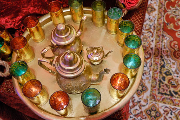 Traditional arabic tea set and dried dates.Top view. stock photo