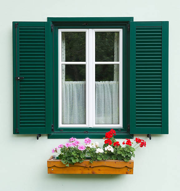 Traditional Austrian Flower Window (XXXL) A traditional timbered austrian country house. Nikon D800e. Converted from RAW. ausseerland stock pictures, royalty-free photos & images