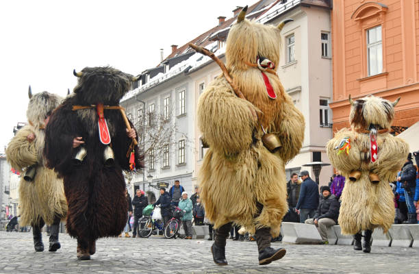 Traditional carnival with traditional figures, known as kurent or korent, Ljubljana, Slovenia stock photo