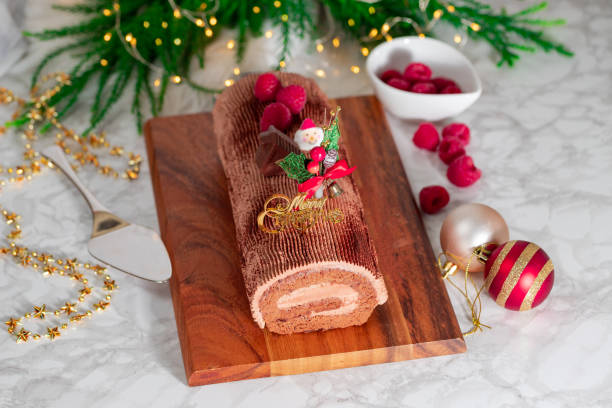 Traditional Christmas cake, chocolate Yule log with festive decorations stock photo