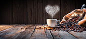 istock Traditional Coffee Cup With Heart-Shaped Steam On Rustic Wood 517518956