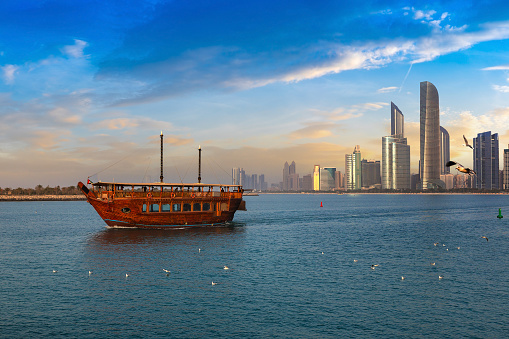 Cruise on traditional Dhow boat in Abu Dhabi in a summer day, United Arab Emirates