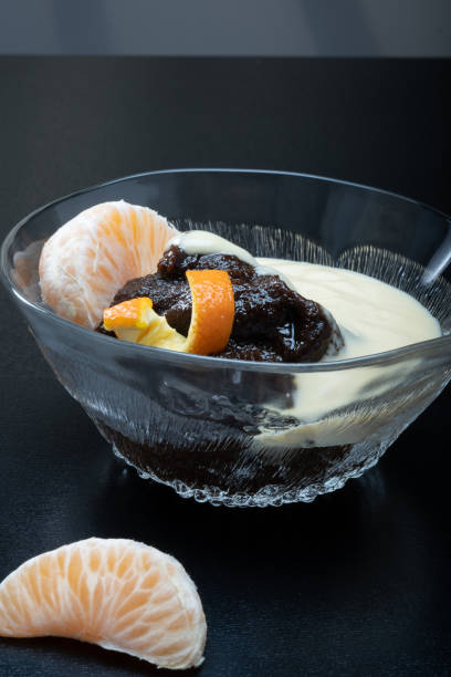 Traditional Finnish cuisine - Typically rye based Mämmi is eaten around Easter with fresh cream or custard. stock photo