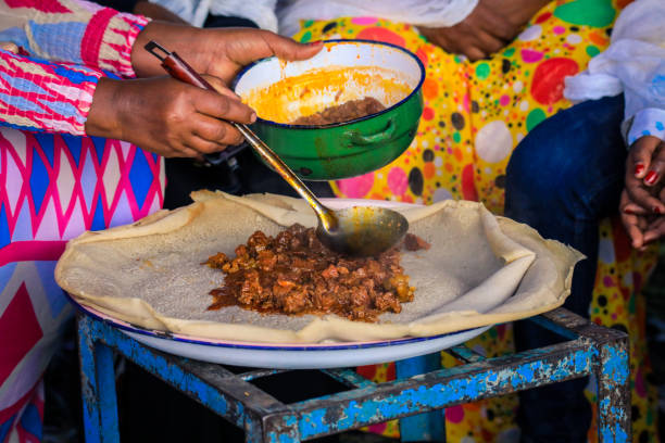 Traditional Food - Stewed Meat with Injeira in Asmara stock photo