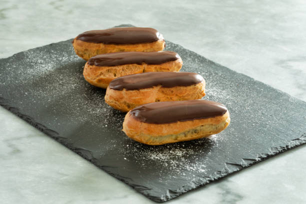 Traditional french pastry : Eclair with chocolate icing stock photo