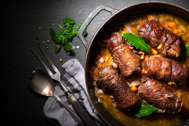 Traditional german meal of beef roulades in roast pot stock photo