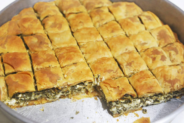 traditional greek spanakopita - spinach pie with the greek cheese feta stock photo