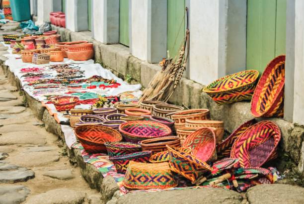 Traditional handicrafts of Brazilian culture displayed on the historic sidewalks of the city of Parati, Rio de Janeiro, Brazil stock photo