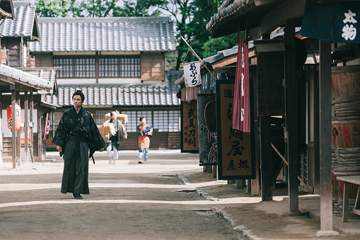 Traditional Japanese samurai walking in Edo period town