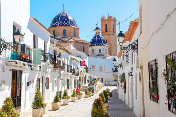 Altea, Spain - May 2019: A traditional mediterranean street in Altea old town, Spain Altea, Spain - May 2019: A traditional mediterranean street in Altea old town, Spain costa blanca stock pictures, royalty-free photos & images