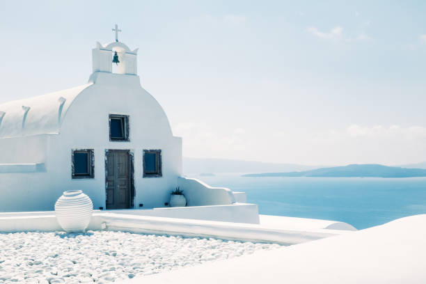 Traditional mediterranean white church in minimalistic design and bright colors, Oia, Santorini, Greece stock photo
